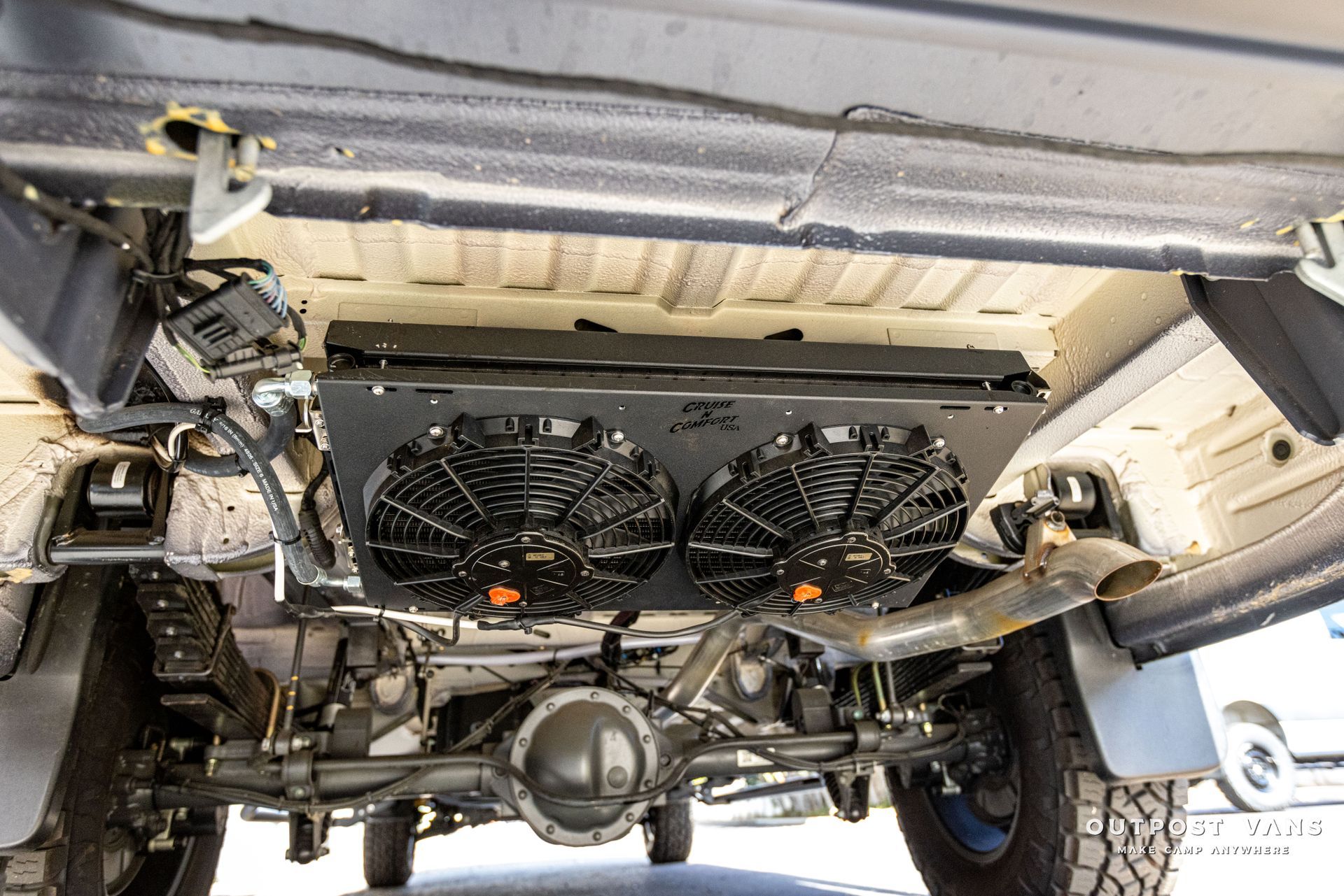 a close up of the underside of a car with a radiator .