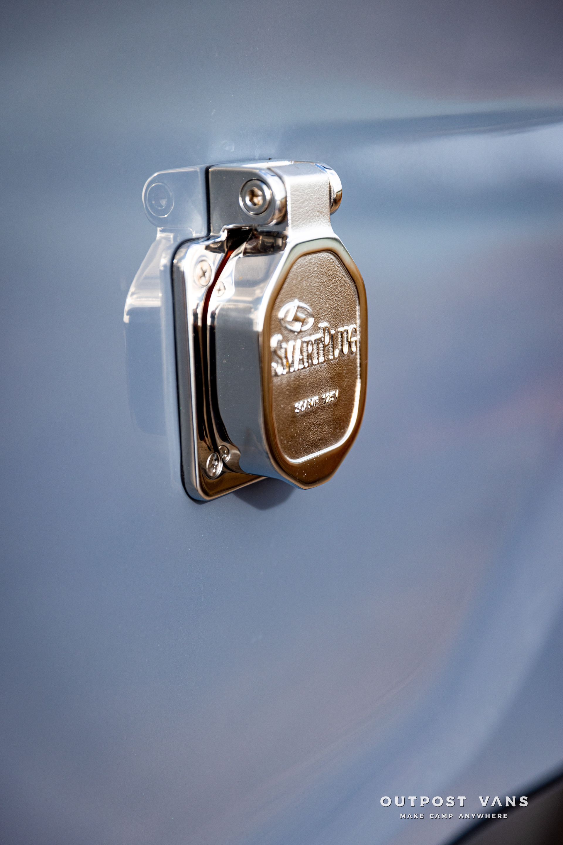 a close up of a plug on the side of a car .