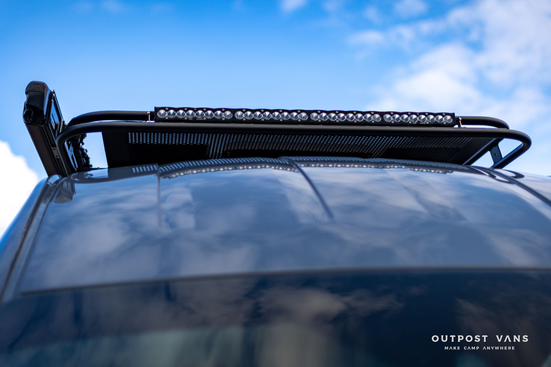 the word outpost is on the side of a car