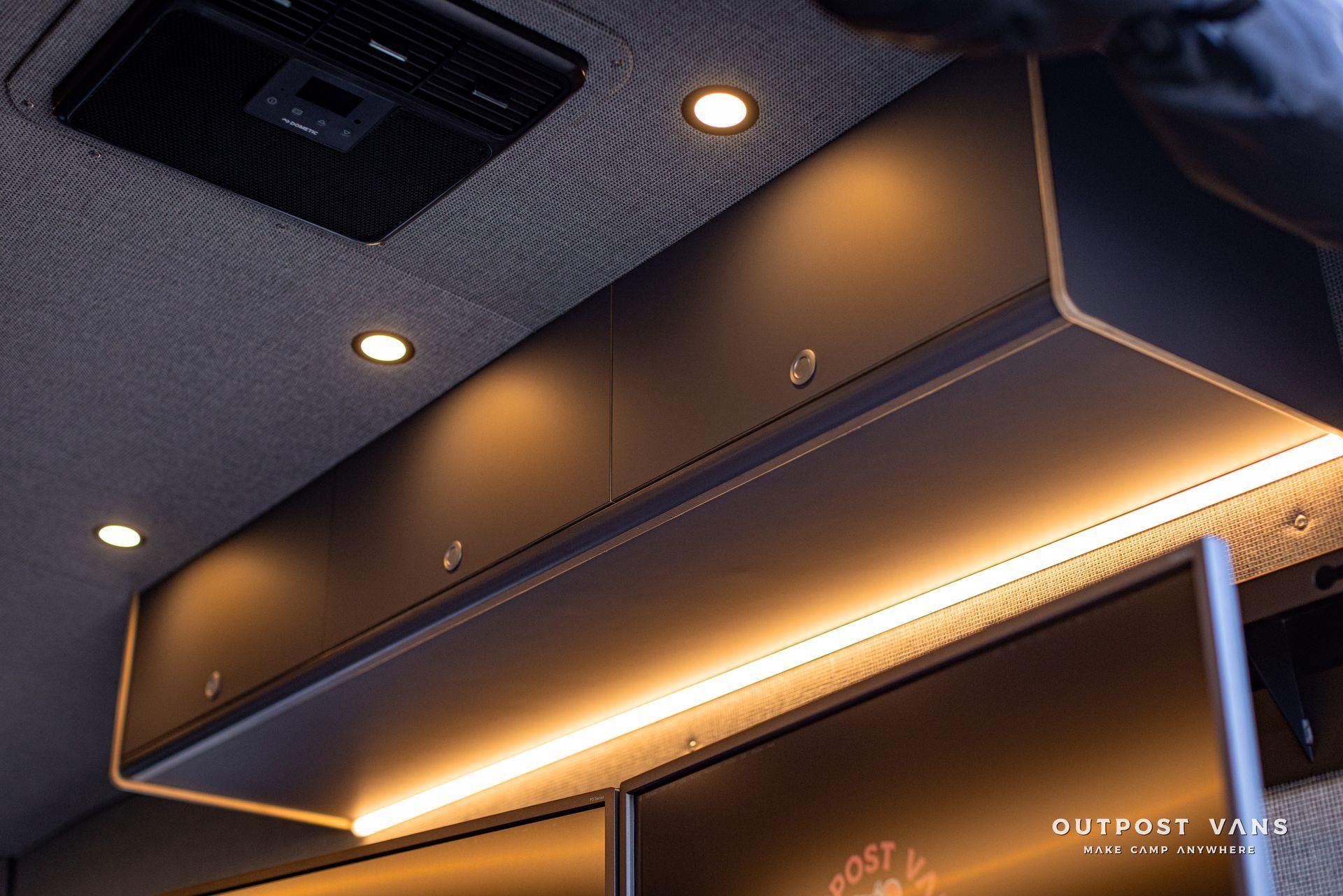 a ceiling with a shelf and lights on it