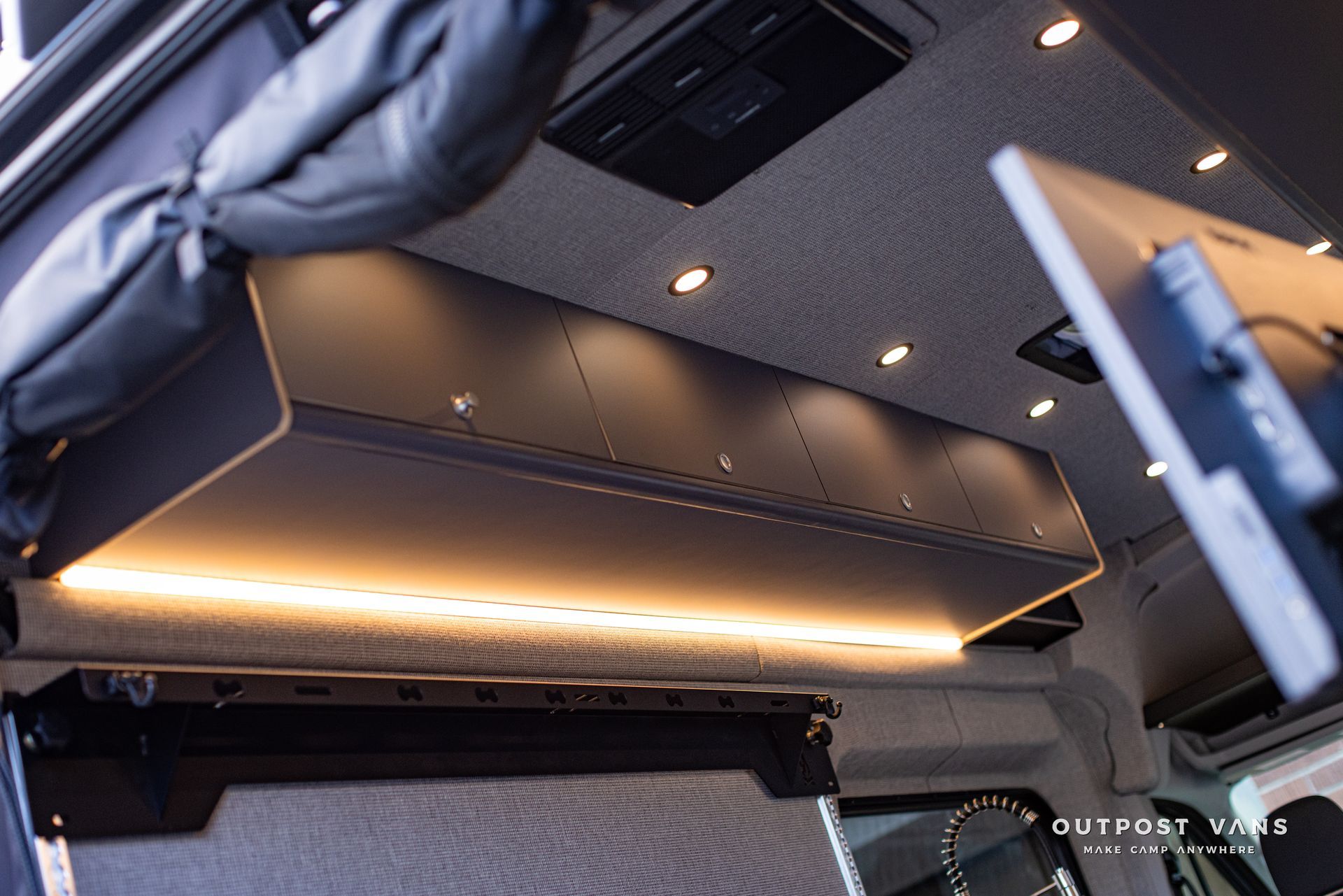 a van with a tv mounted to the ceiling .