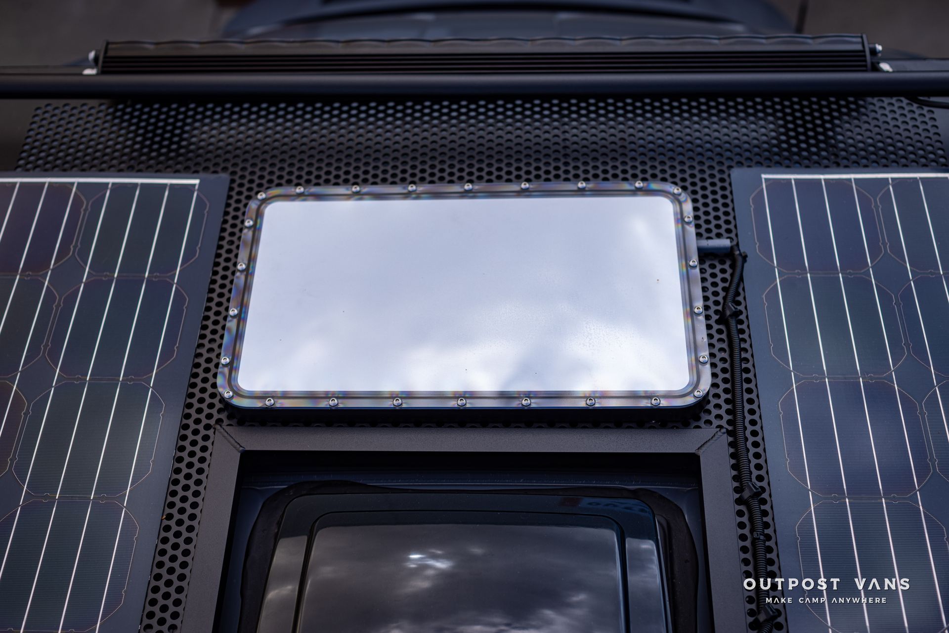 a car with solar panels and a mirror on the roof .