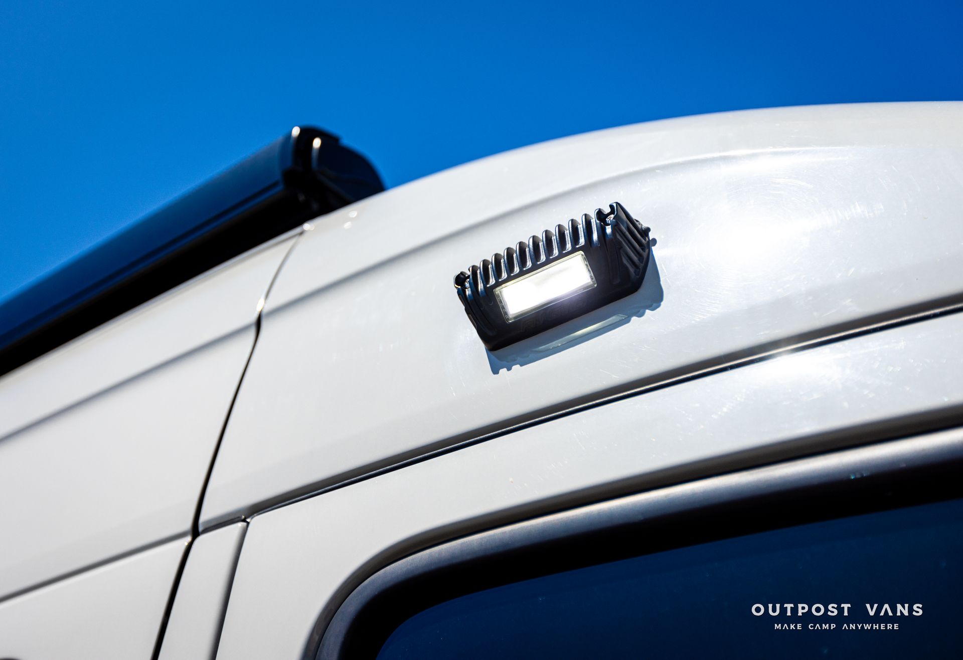 A white van with the word outport vans on the side