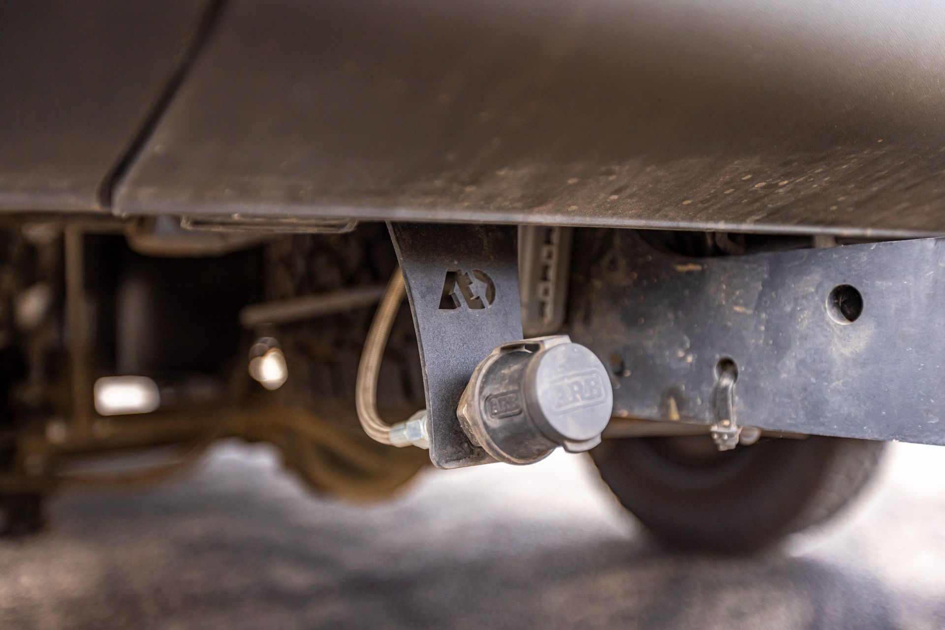 A close up of a tow hook on the back of a car.