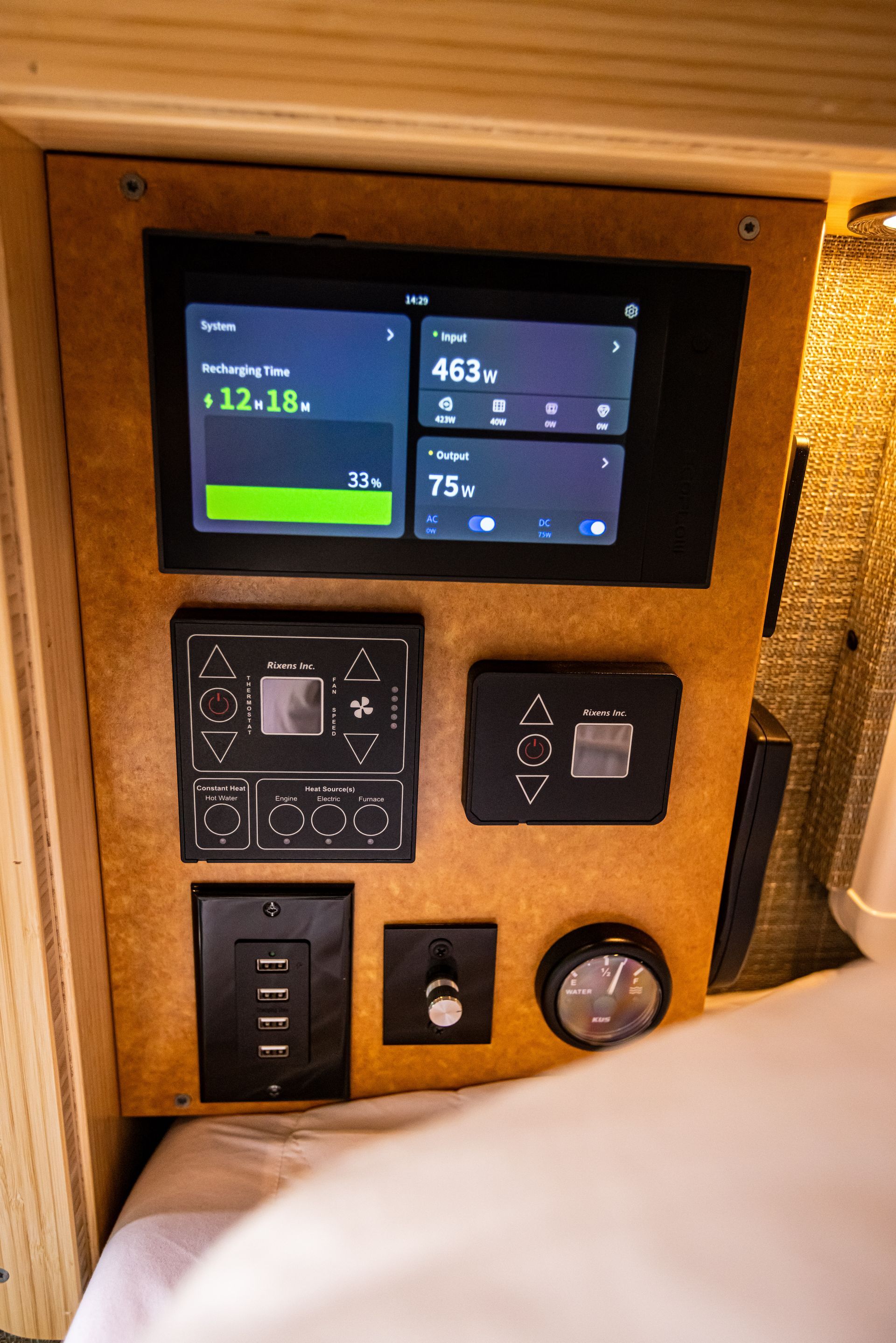 A wooden panel with a screen and buttons on it.
