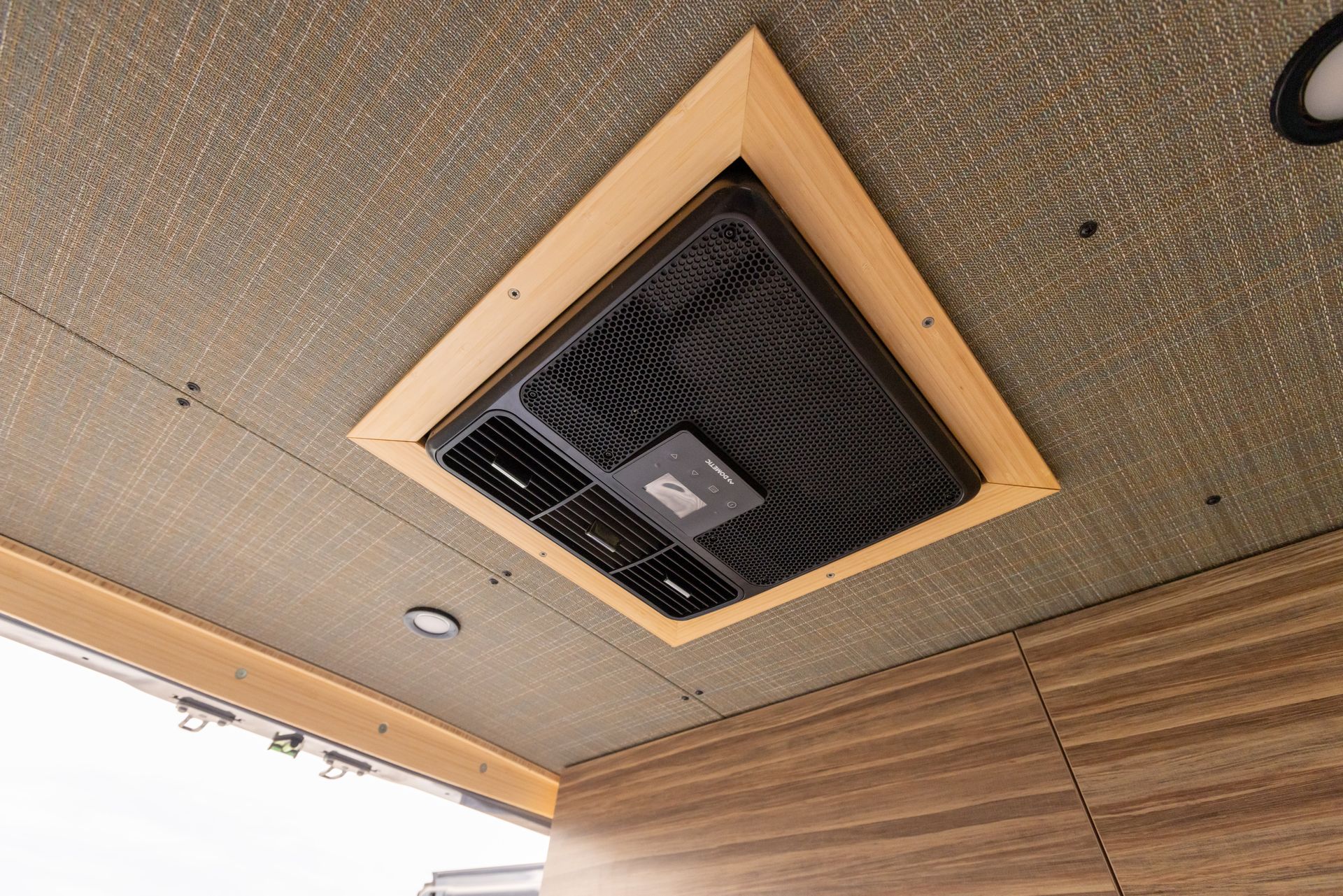 A fan is hanging from the ceiling of a room.