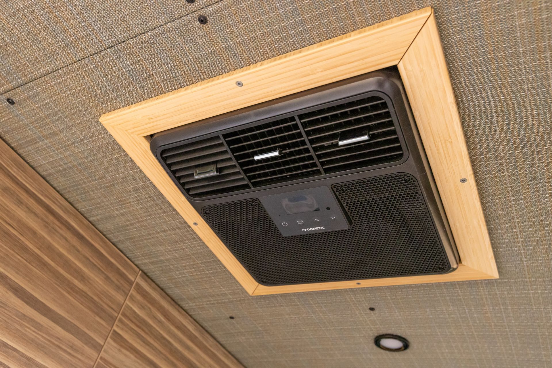 A fan is hanging from the ceiling of a room.