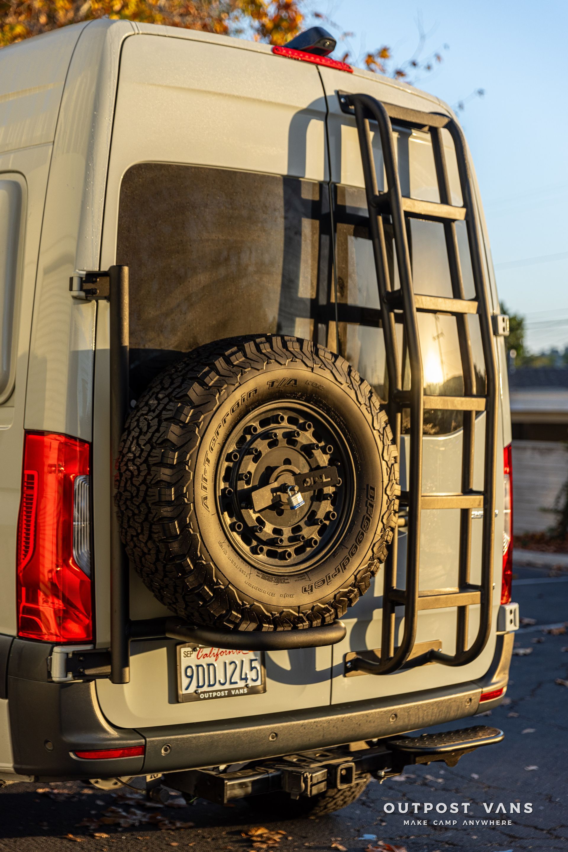a van with a ladder attached to the back of it .