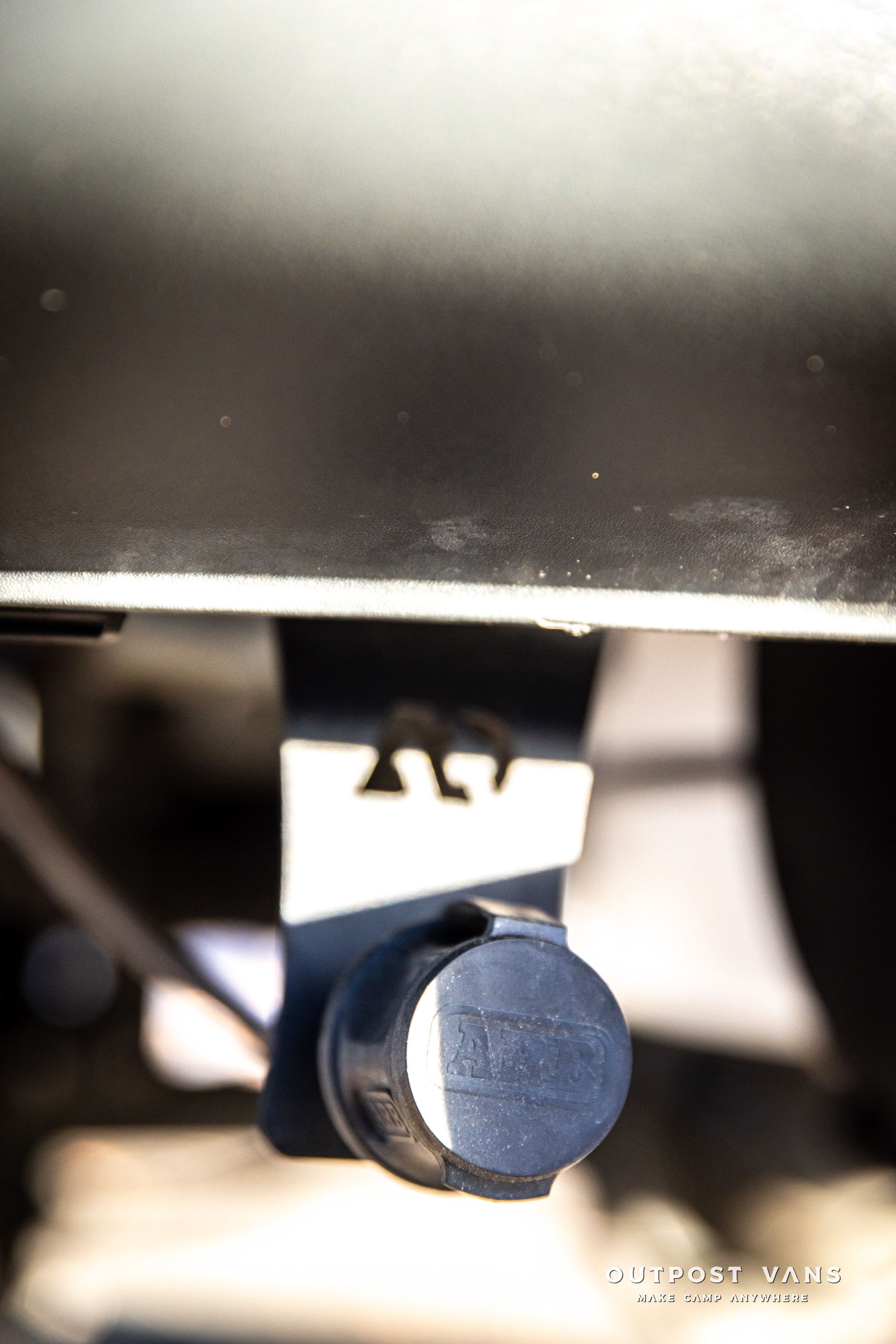 a close up of a black and white object on a car .