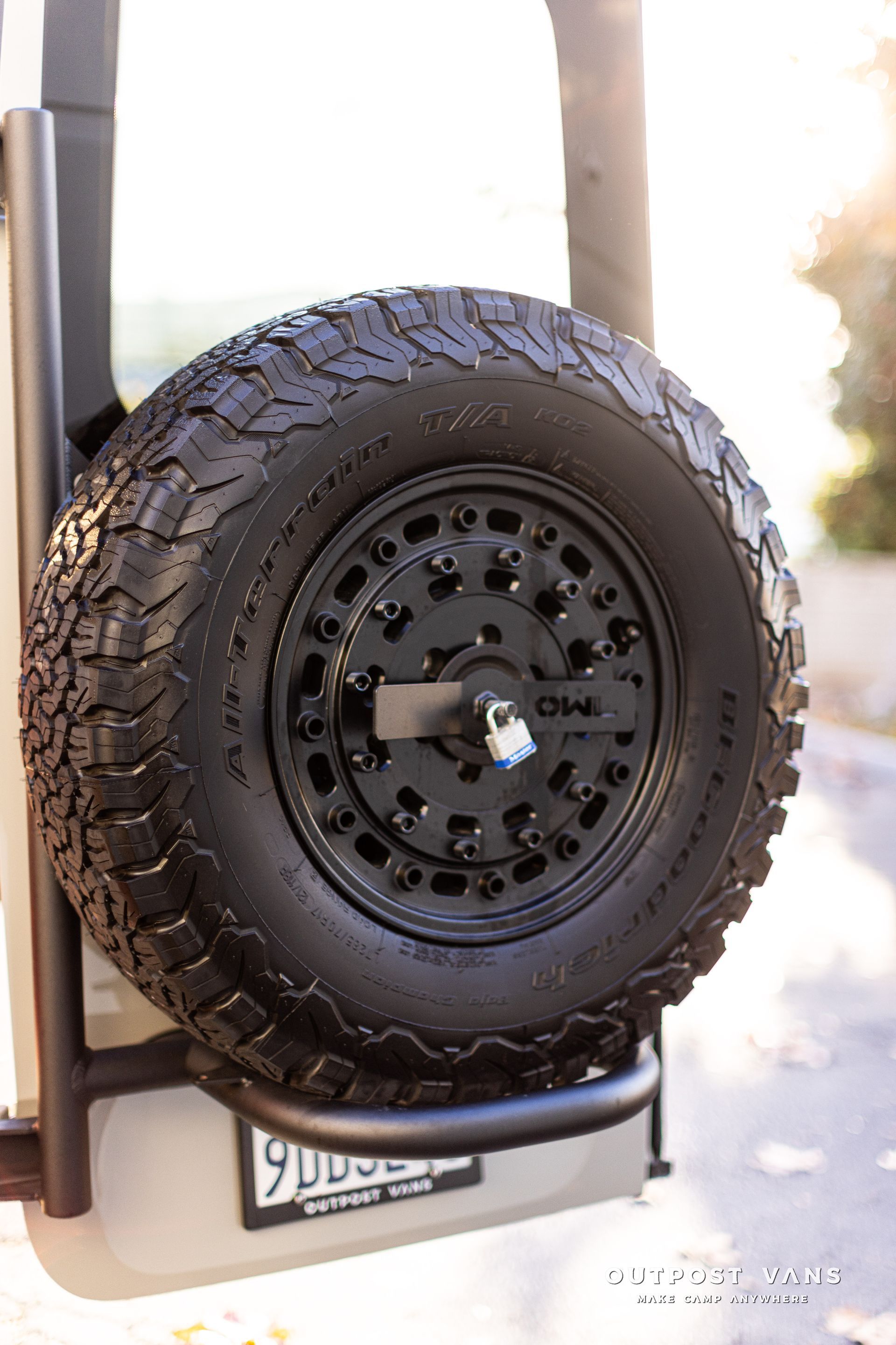 a close up of a tire on the back of a vehicle .