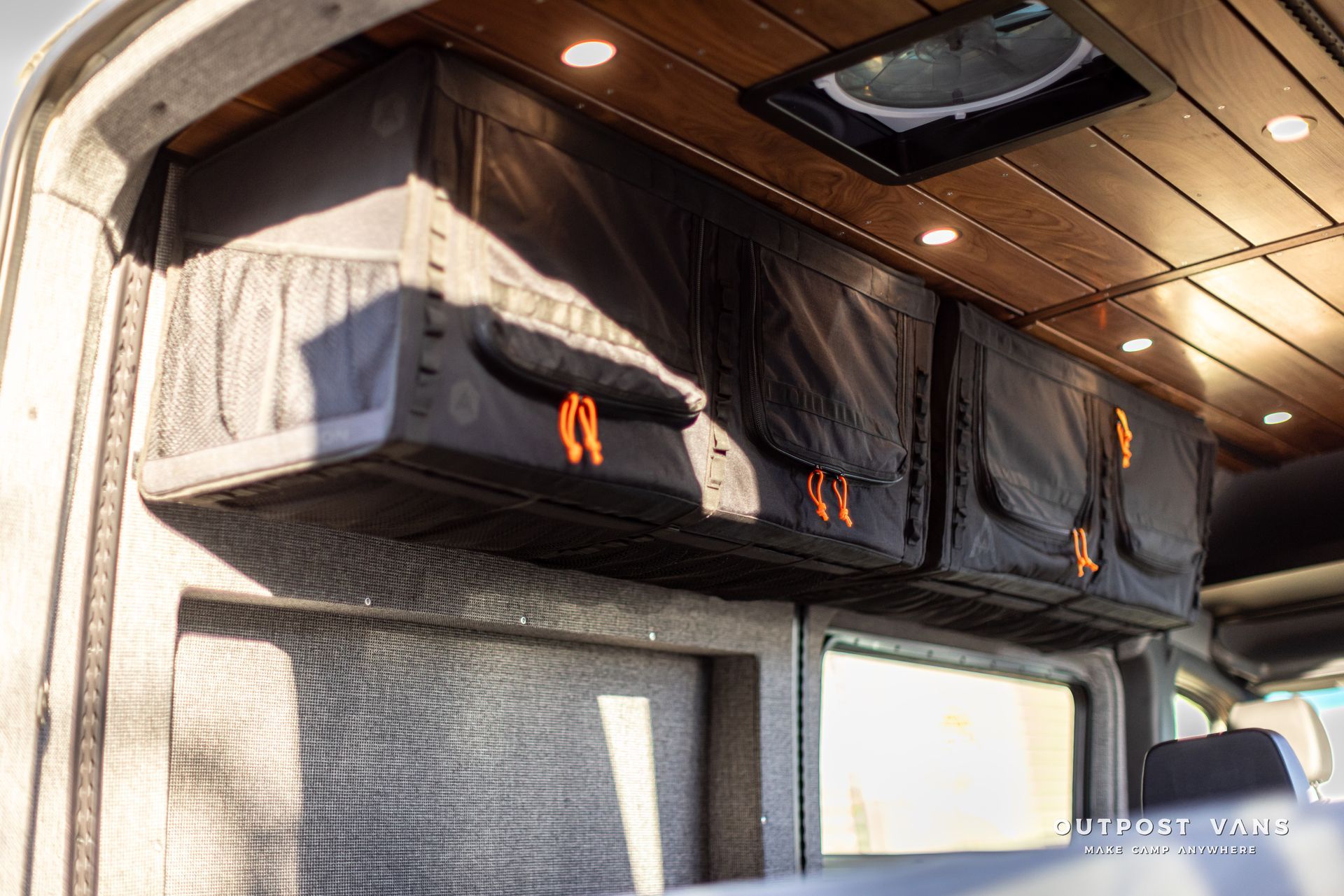 a van with a ceiling fan and lots of storage space .
