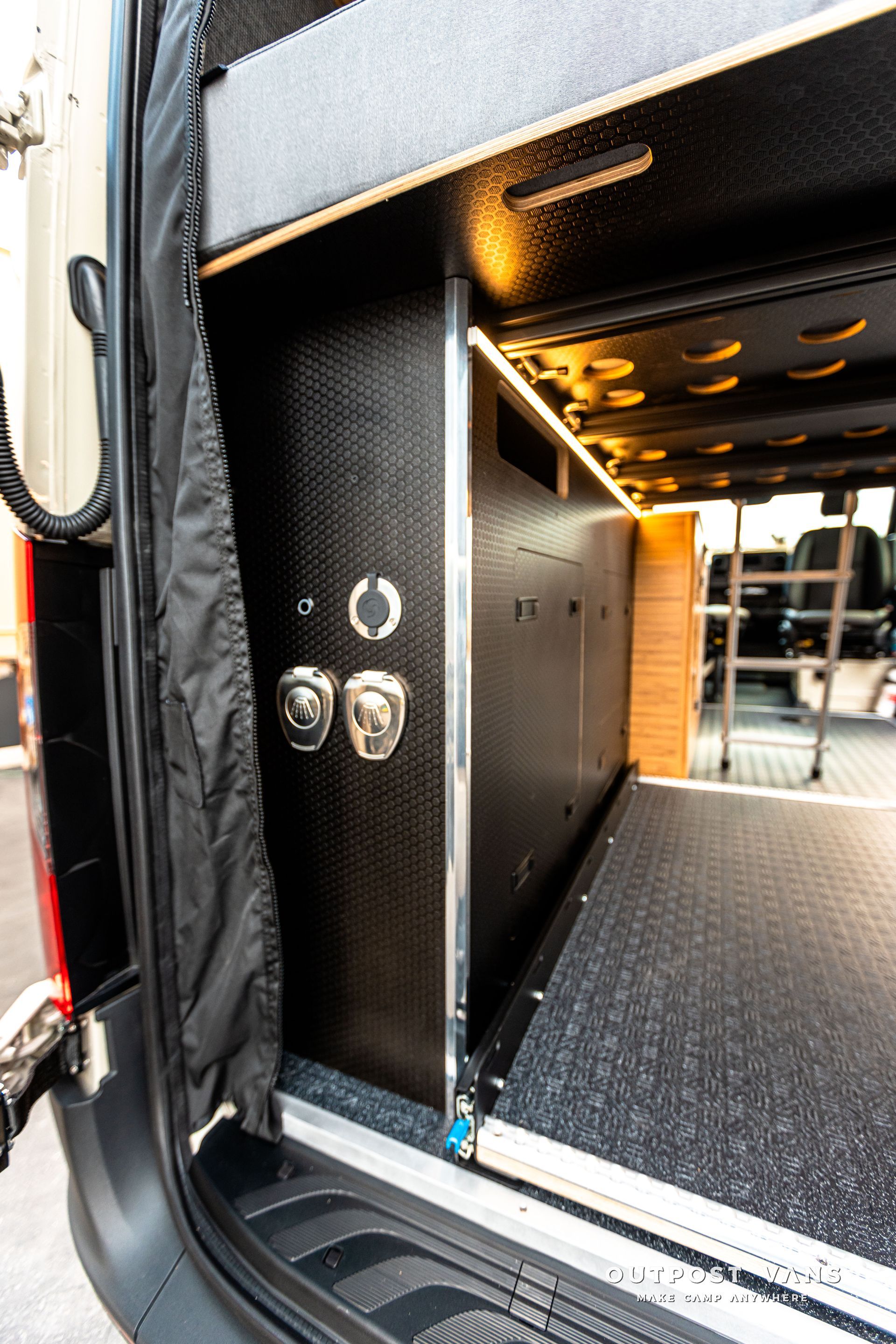 A van with a ramp in the back of it.