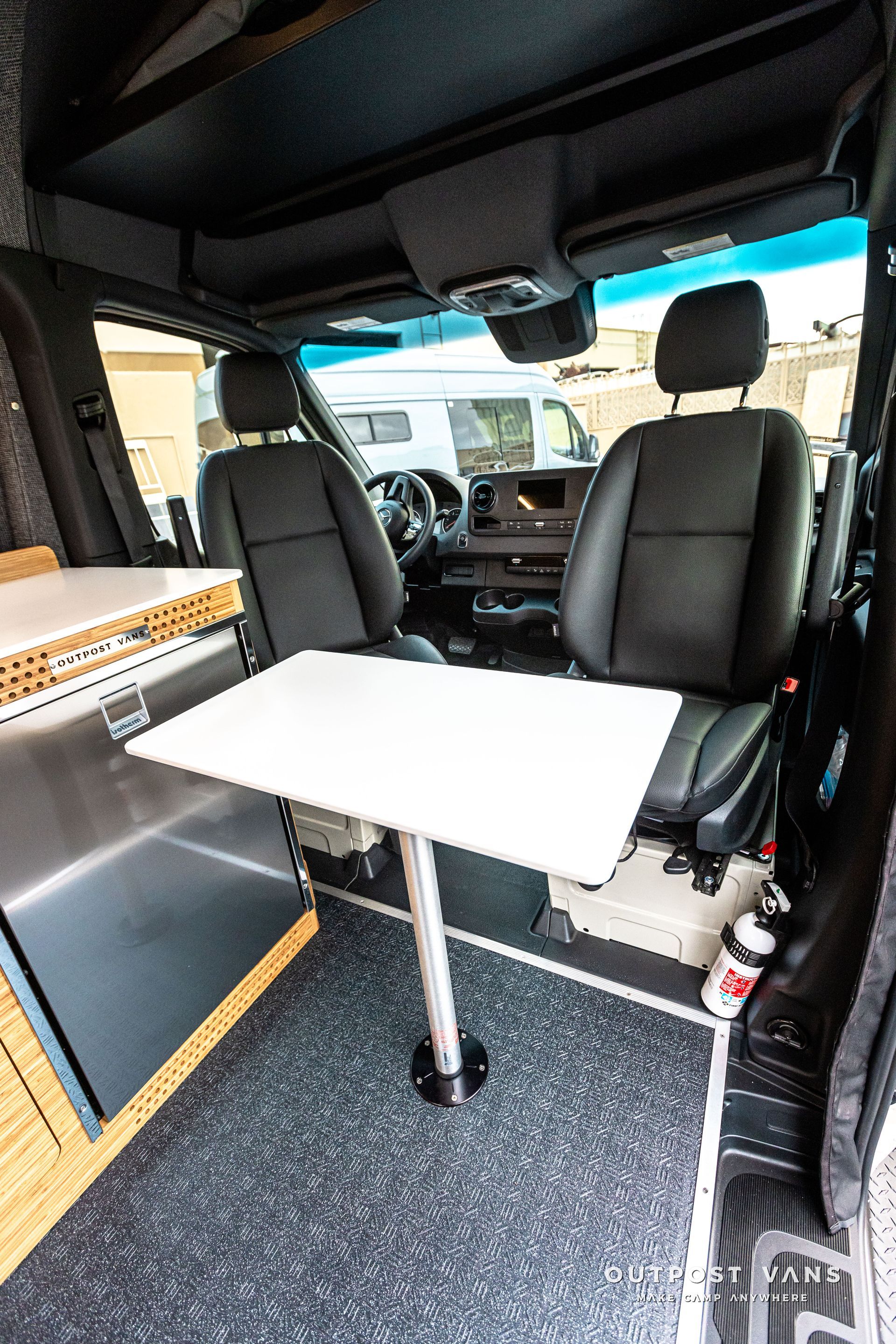 A table is sitting in the back seat of a van.