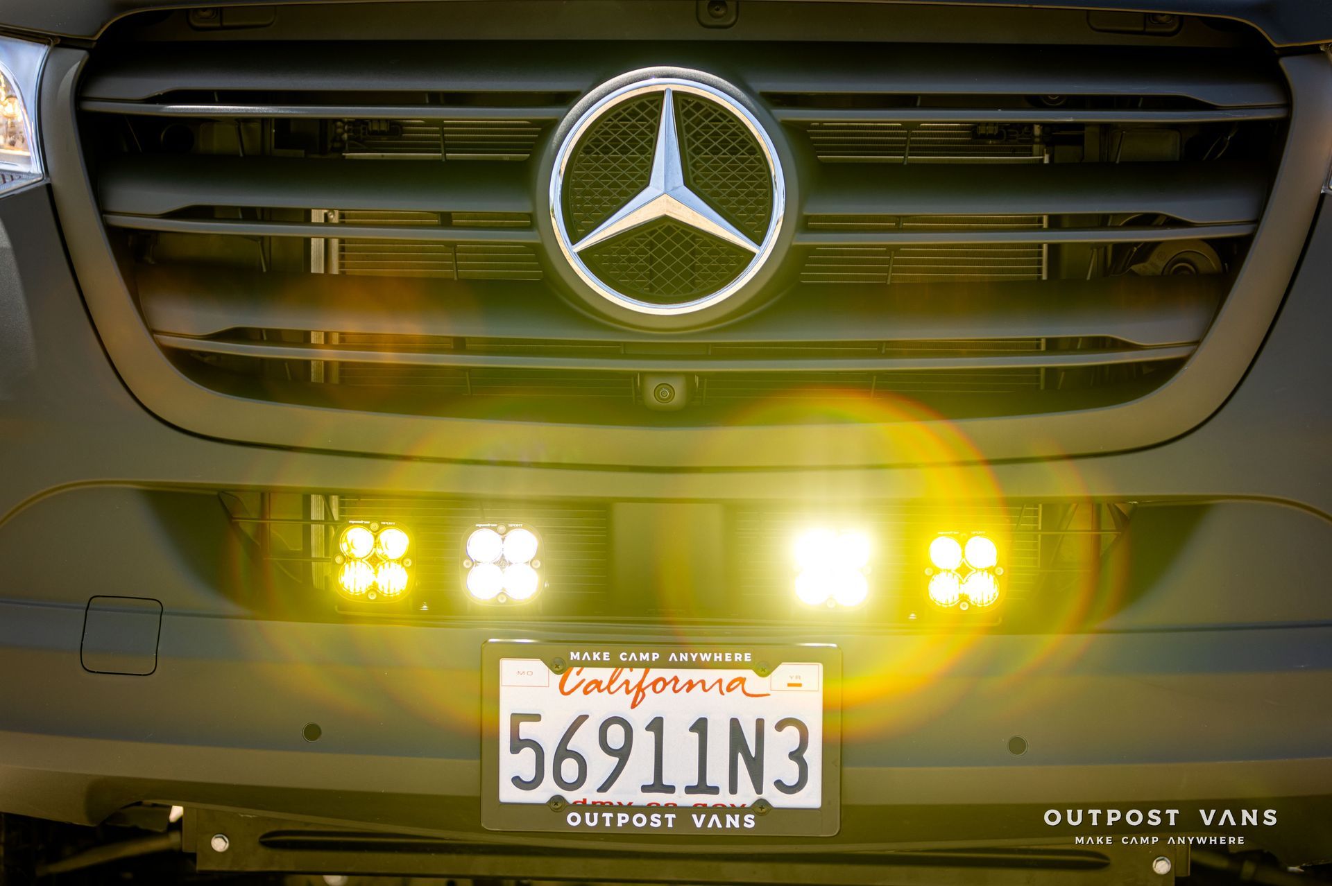 The front of a mercedes with a license plate that says 5691n3
