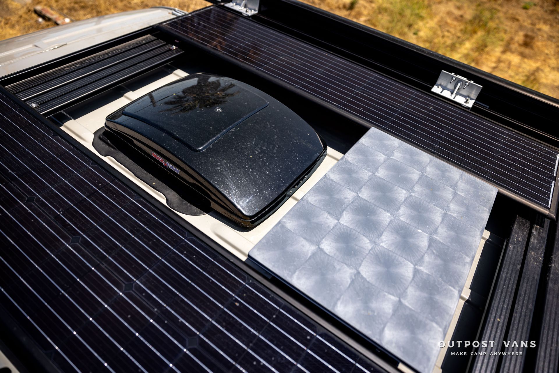 The roof of a car with solar panels on it.