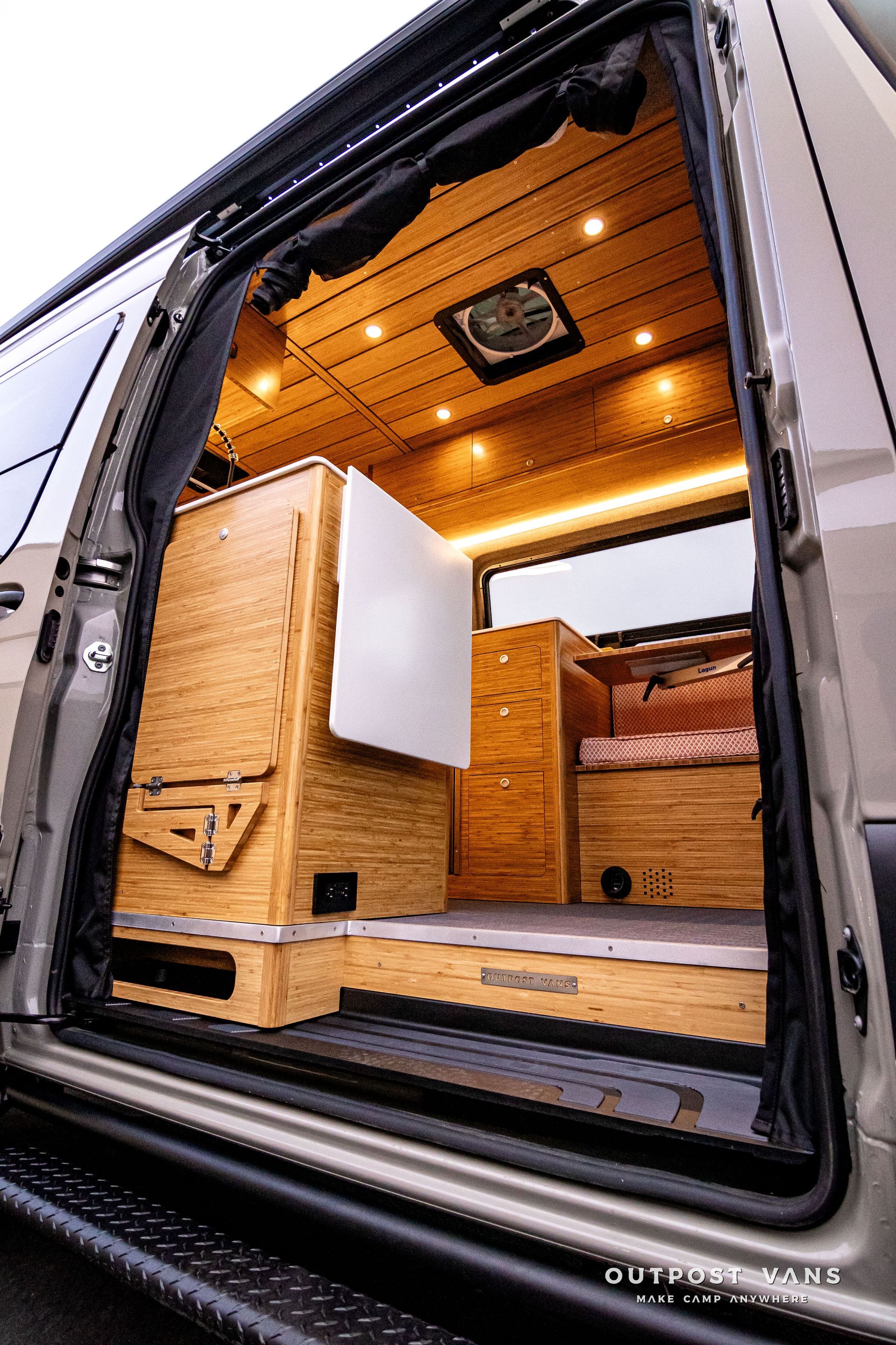 The inside of a camper van with the door open.