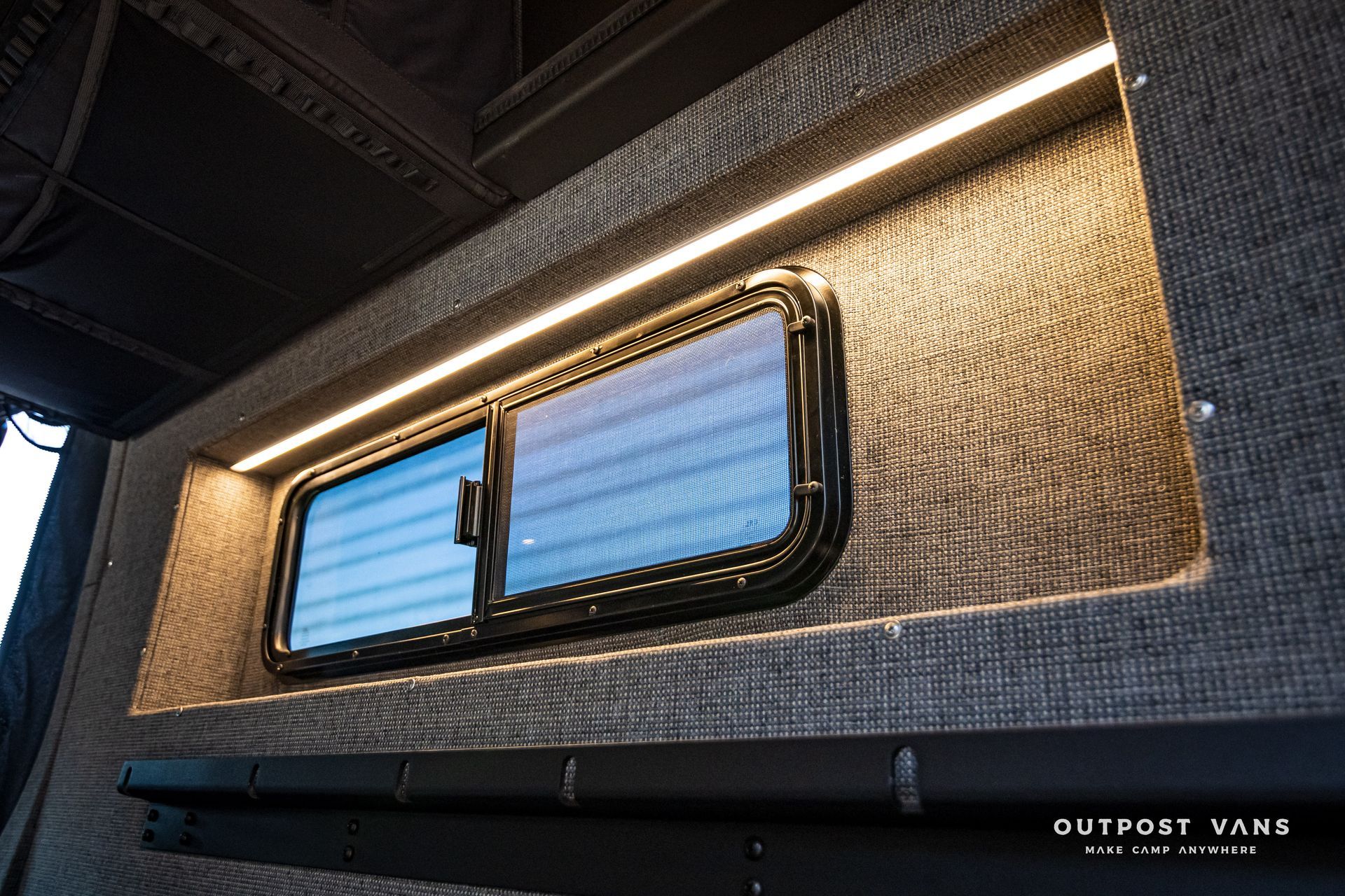 A window in a van with a light on it.