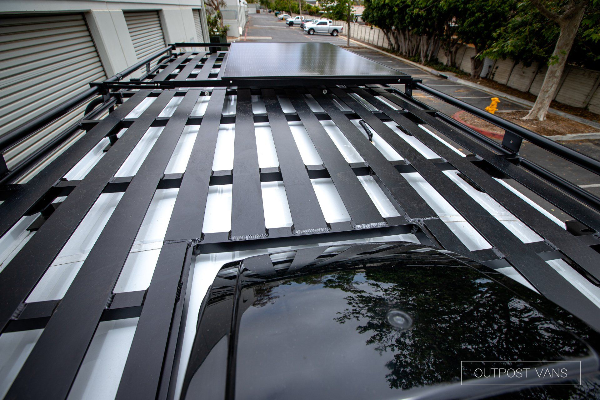 a roof rack with a solar panel on top of it