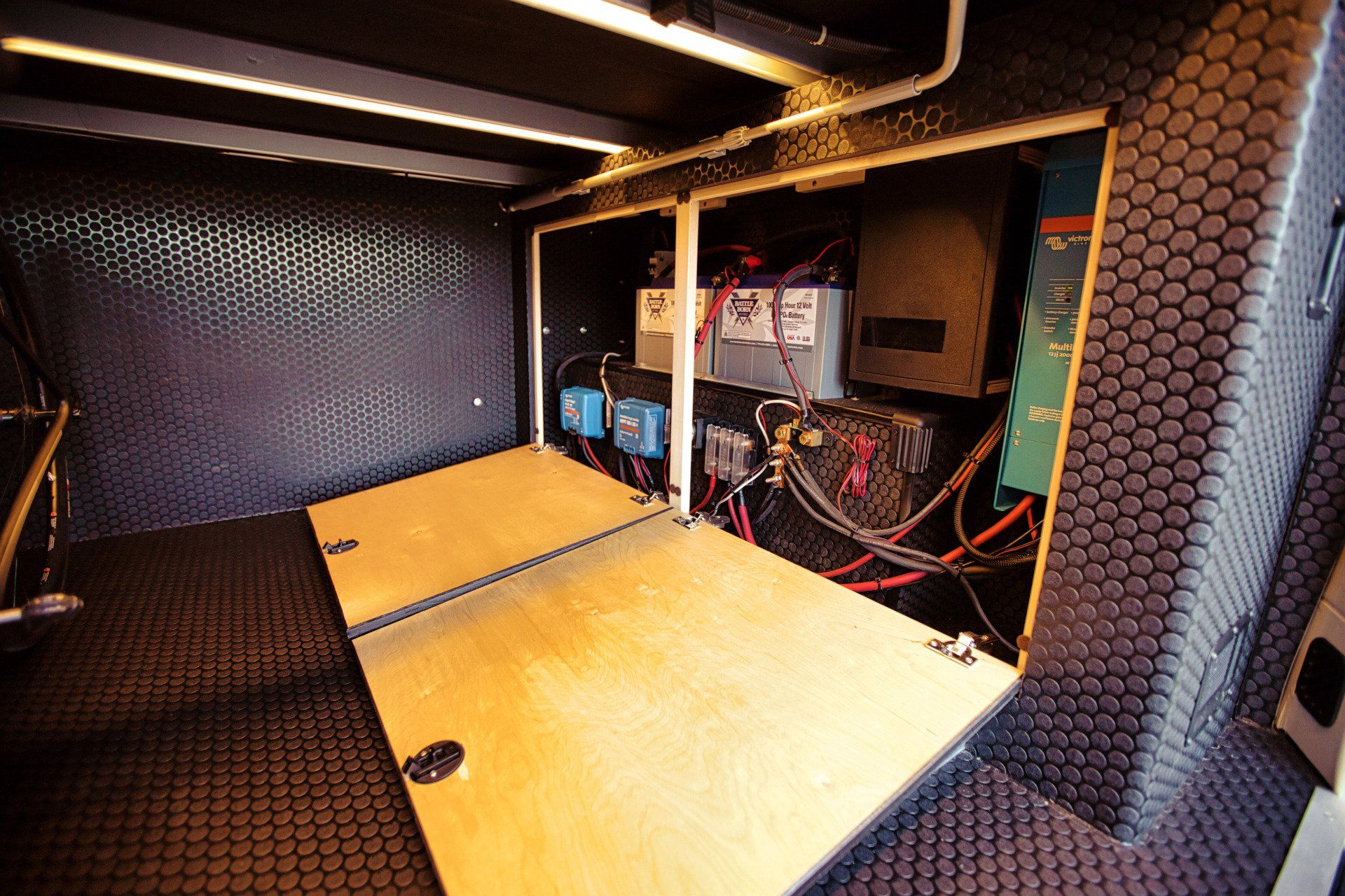 The inside of a vehicle with a lot of wires coming out of it.