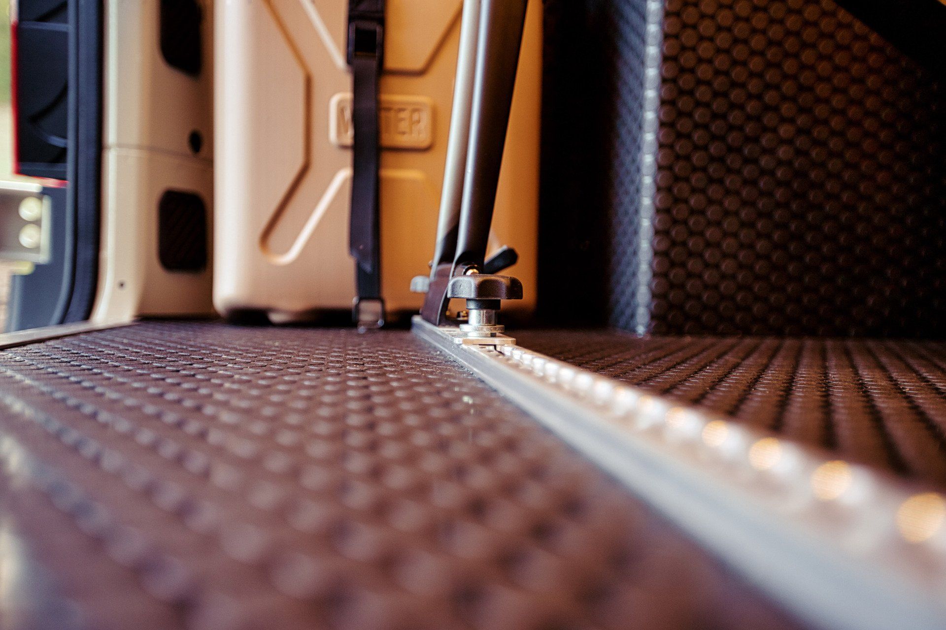 A close up of a luggage rack in a van.