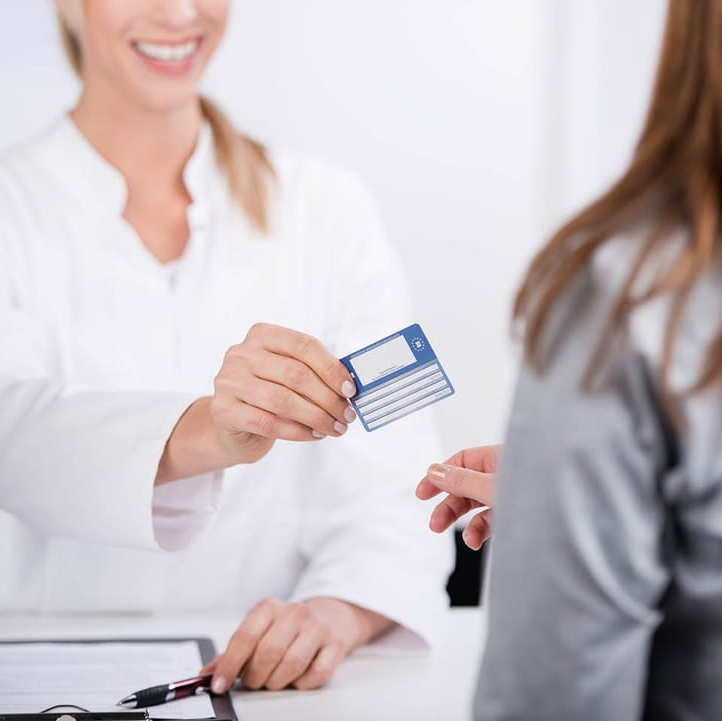 Patient paying for dental care with membership plan