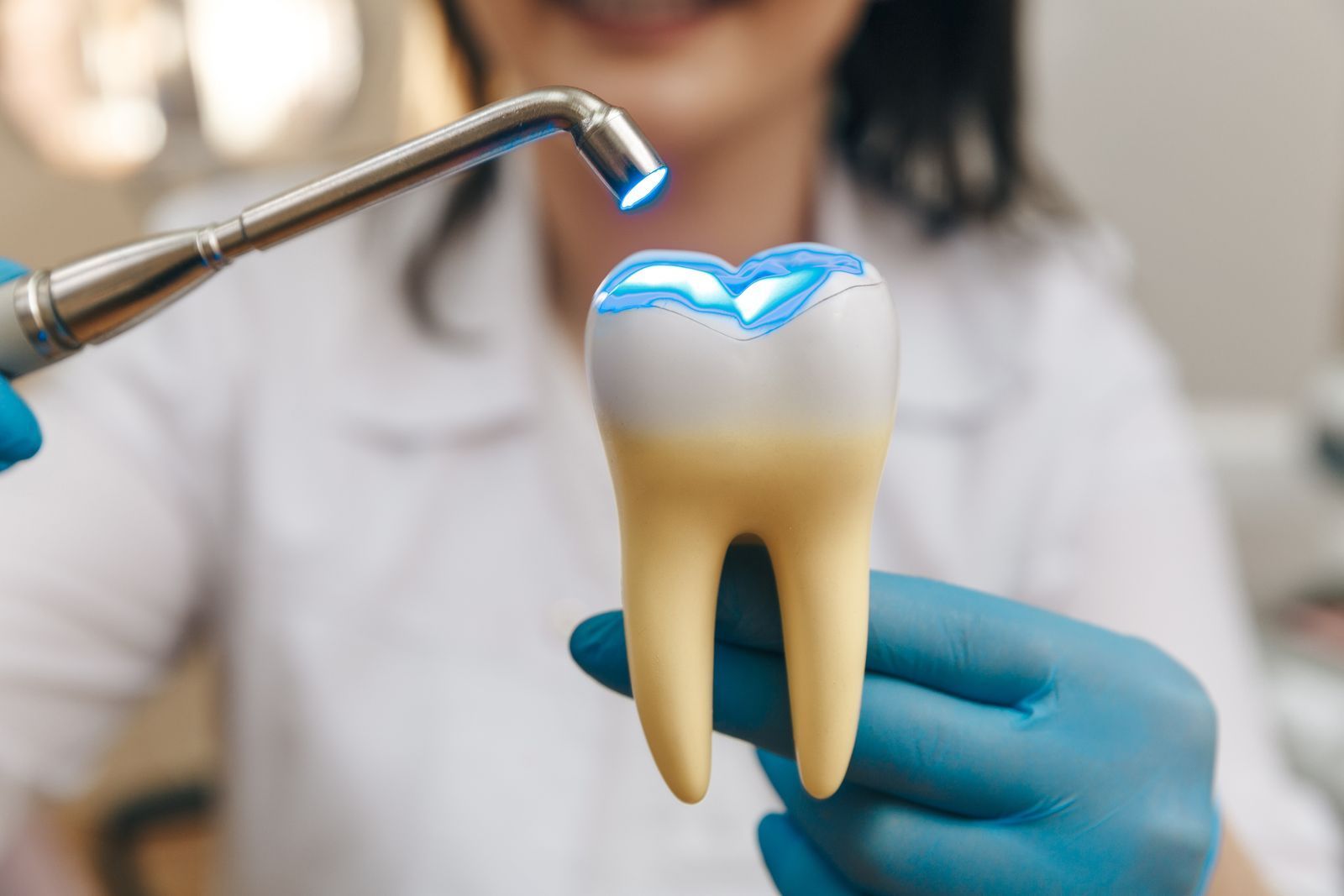 dentist showing example of repairing a cracked tooth