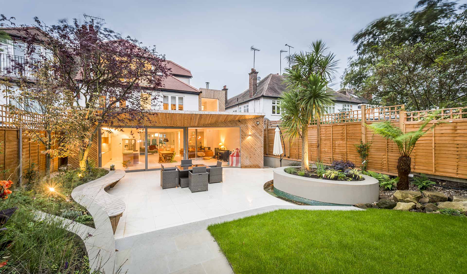 Large outdoor area with lawn paved patio and outdoor studio