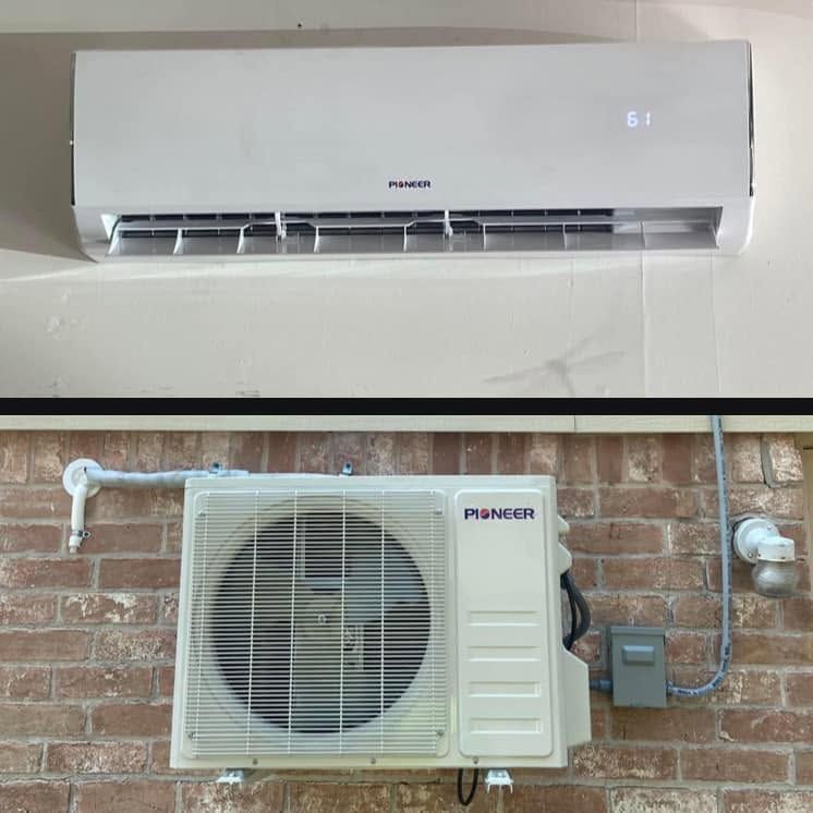 Indoor and outdoor units of a wall-mounted split air conditioner on a white wall and brick exterior.
