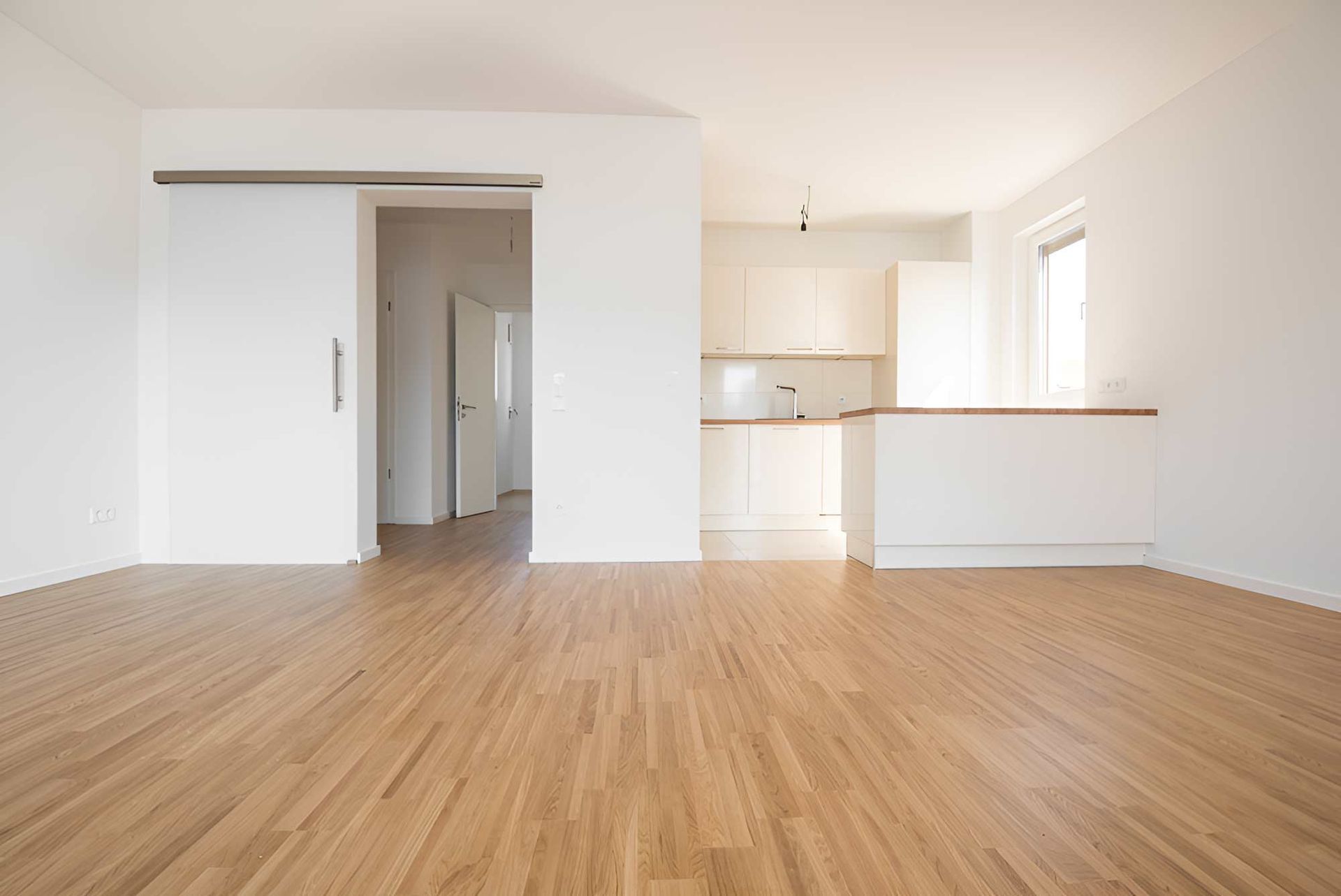 New Empty House With Vinyl Flooring Installed — Flooring Direct Mid North Coast in Nambucca, NSW