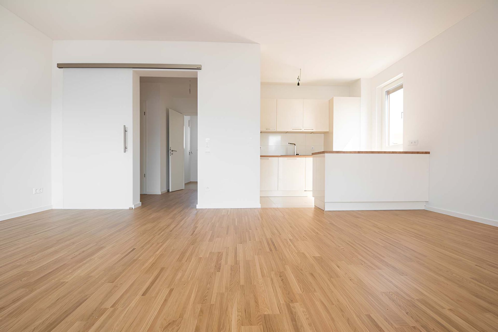 Empty Flat With Wooden Beech Flooring — Flooring Direct Mid North Coast in Port Macquarie, NSW