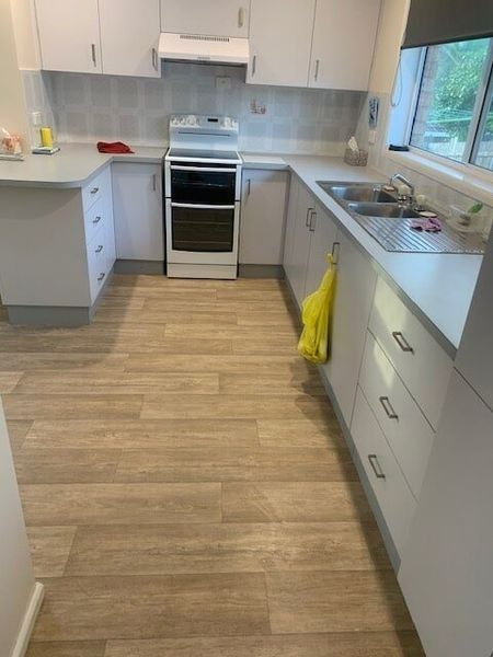 A Kitchen With White Cabinets — Flooring Direct Mid North Coast in South Kempsey, NSW