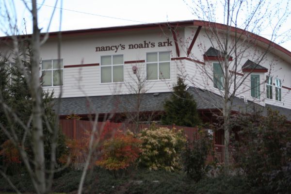 Barny's Noah's Ark building with a red roof and trees in front