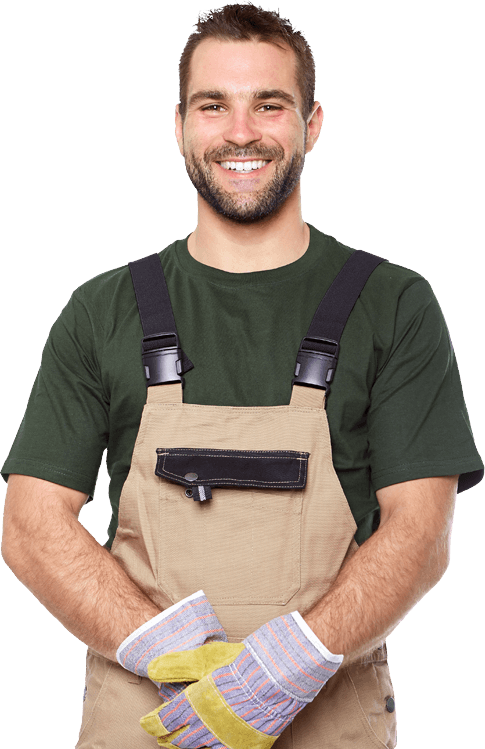 Smiling person in overalls and work gloves.