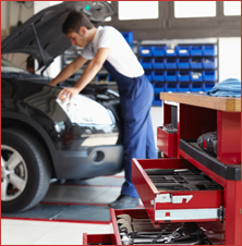 Technician Examining Car
