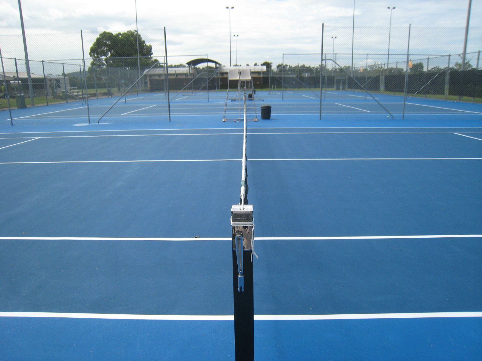Blue Tennis Court with White Lines and a Net — Queensland, Australia — Jordin Sports Constructions