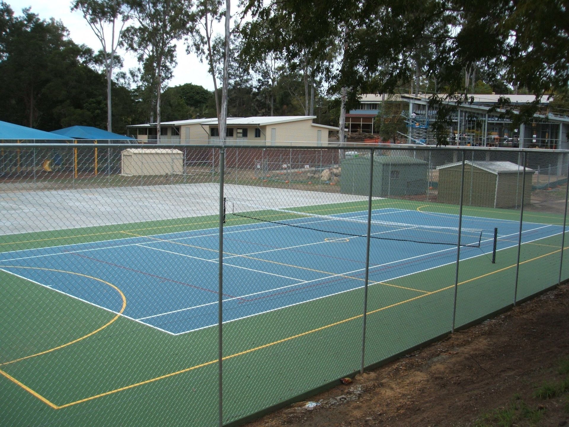 Tennis Court with a Fence Around It — Queensland, Australia — Jordin Sports Constructions