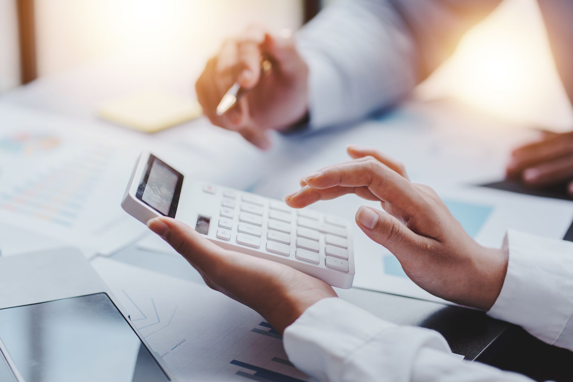 The financiers are calculating personal taxes for their customers. The financiers are calculating personal taxes for their customers.