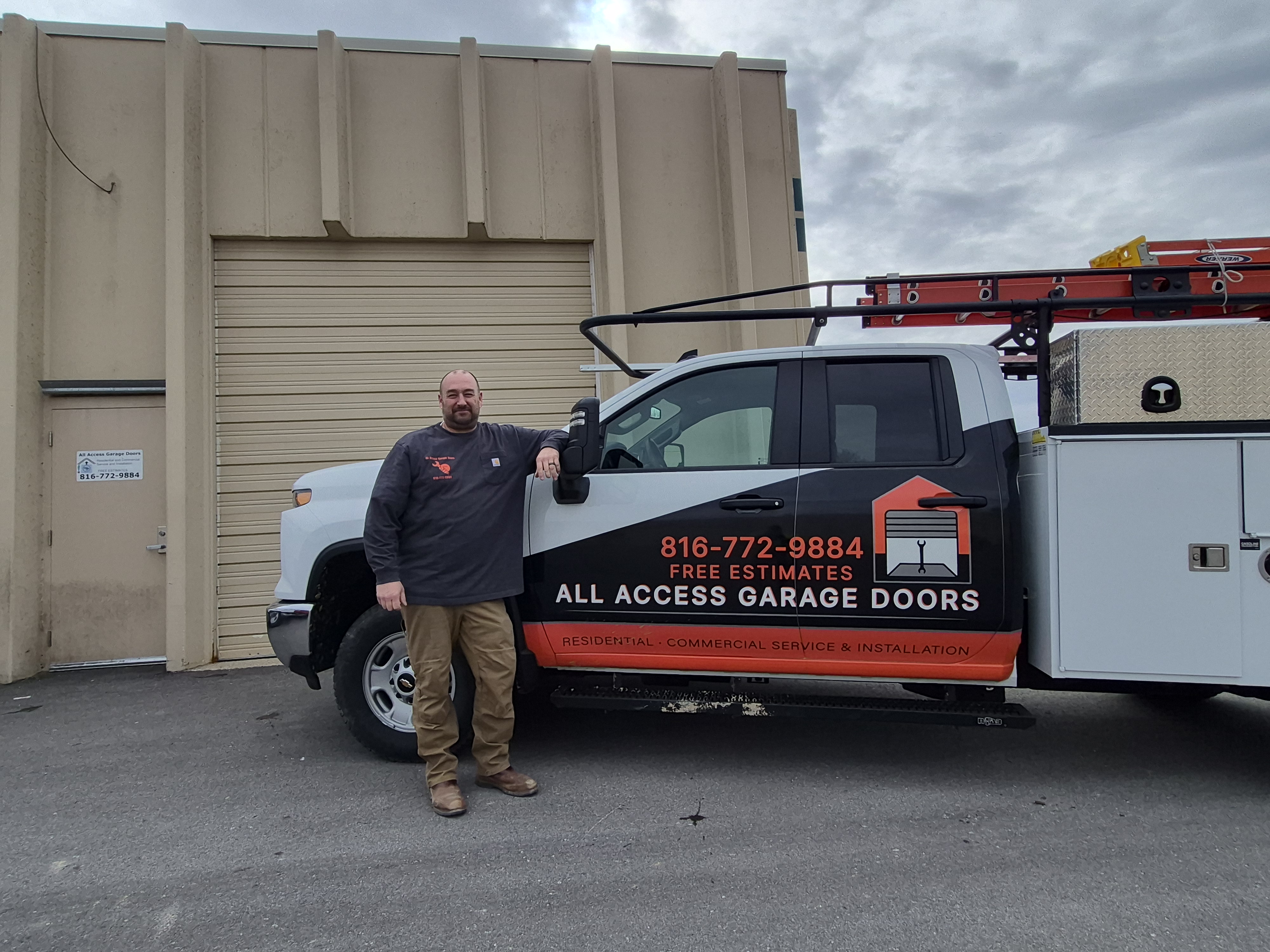Man standing by a work truck with