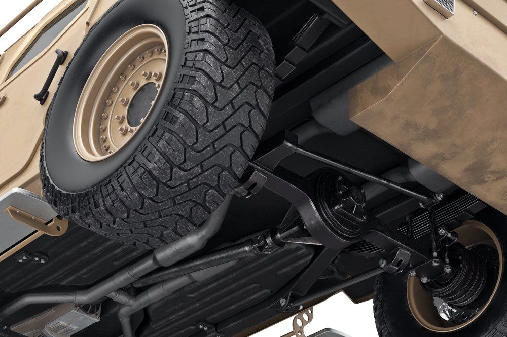 The Underside of a Military Vehicle With a Spare Tire Attached to It — SVS Auto Repairs & Dyno Tuning in Cairns, QLD