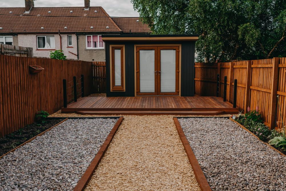 A Backyard With A Shed And A Wooden Fence — Hitek Frame & Truss In Dubbo, NSW