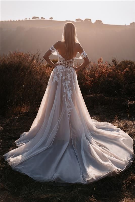 A Bride in an Elegant, Lace-embellished Wedding Gown — Just Formals in Winnellie, NT