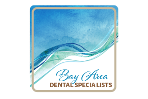 A logo for bay area dental specialists with a blue and green wave