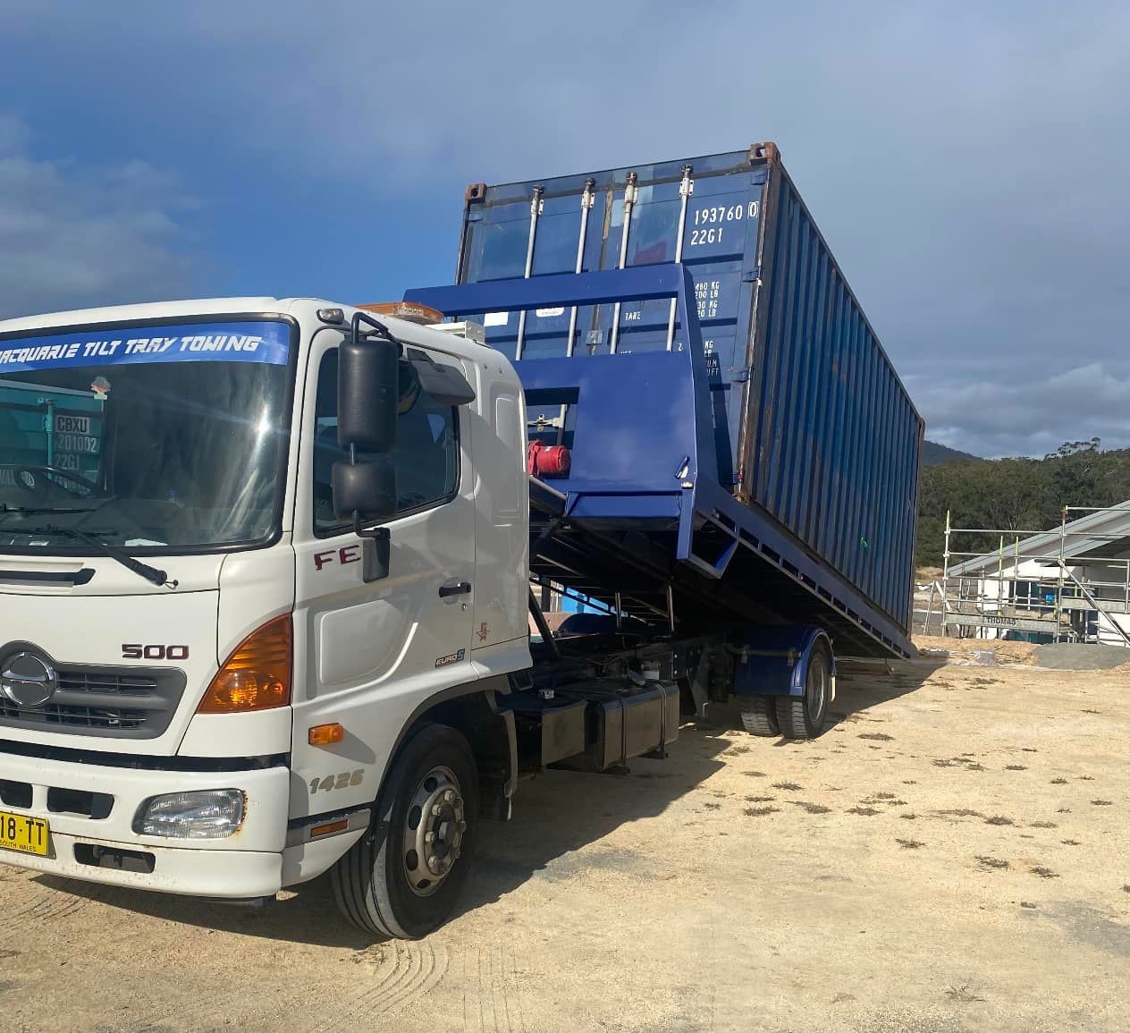 Truck Parked in the Container Yard Loading A Container — Port Macquarie Tilt Tray Towing in Telegraph Point, NSW