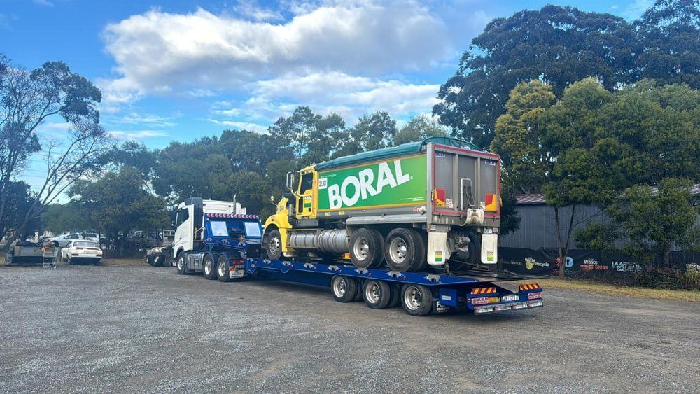 A Truck With the Word Boral on the Side is Parked in a Parking Lot — Port Macquarie Tilt Tray Towing in Kempsey, NSW