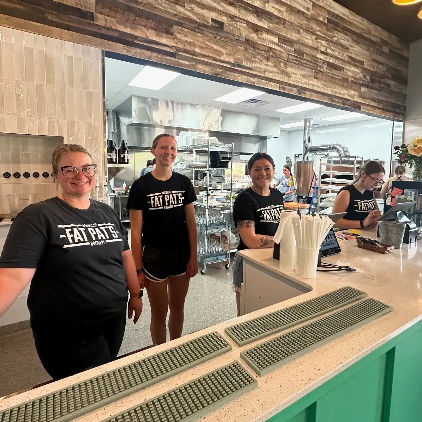4 women behind a counter