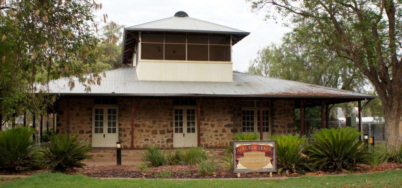 A large brick building with a sign in front of it that says ' a ' on it
