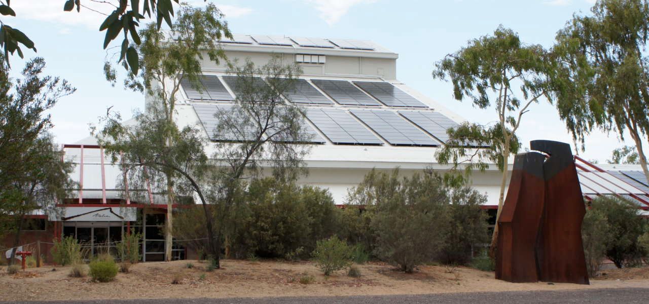 A building with a lot of solar panels on the roof