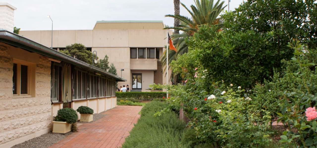 A building with a brick walkway leading to it