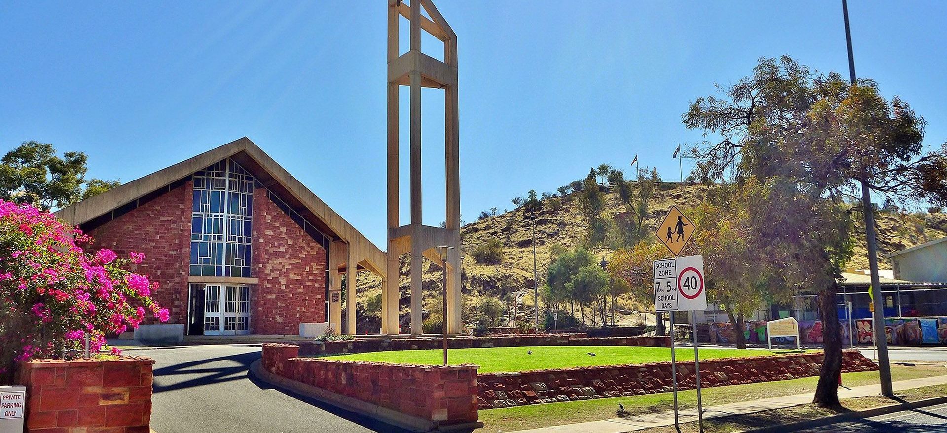 A church with a no parking sign in front of it