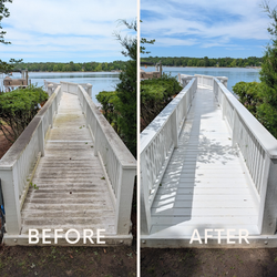 Weathered wooden dock extending toward calm green water with a small algae-covered edge.